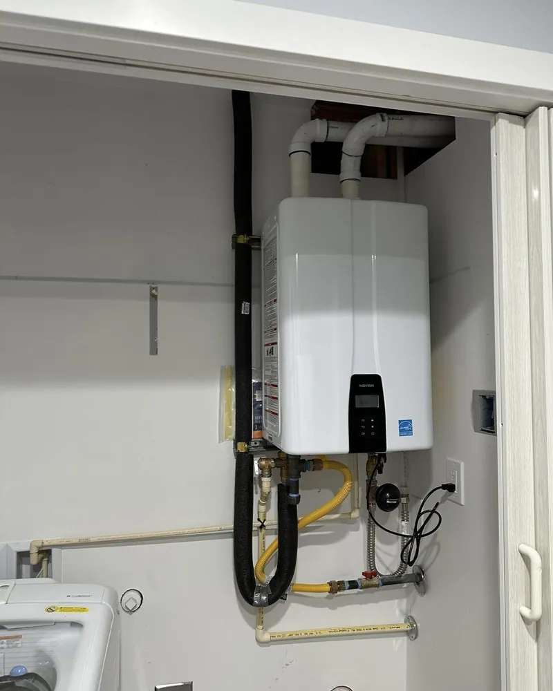 New tankless unit installed in a laundry closet