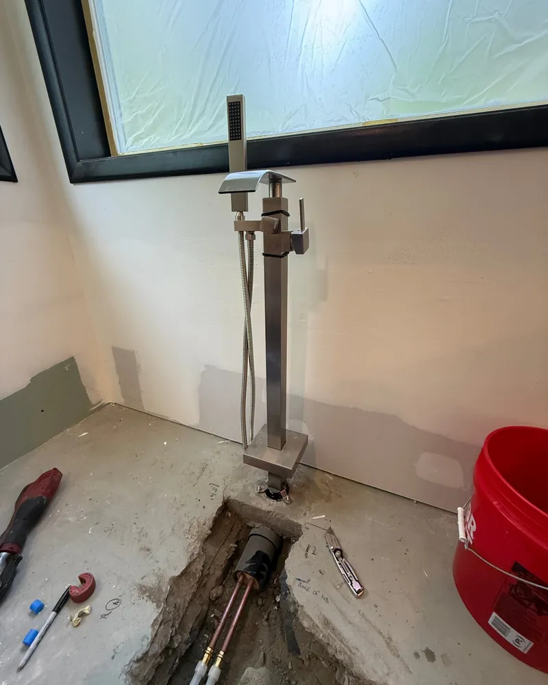 Freestanding tub filler plumbed through the slab